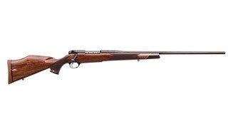 Bolt action rifle with 26" high gloss blued barrel and walnut stock.